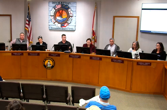 Commissioner proposes delaying paid parking pending citizen vote