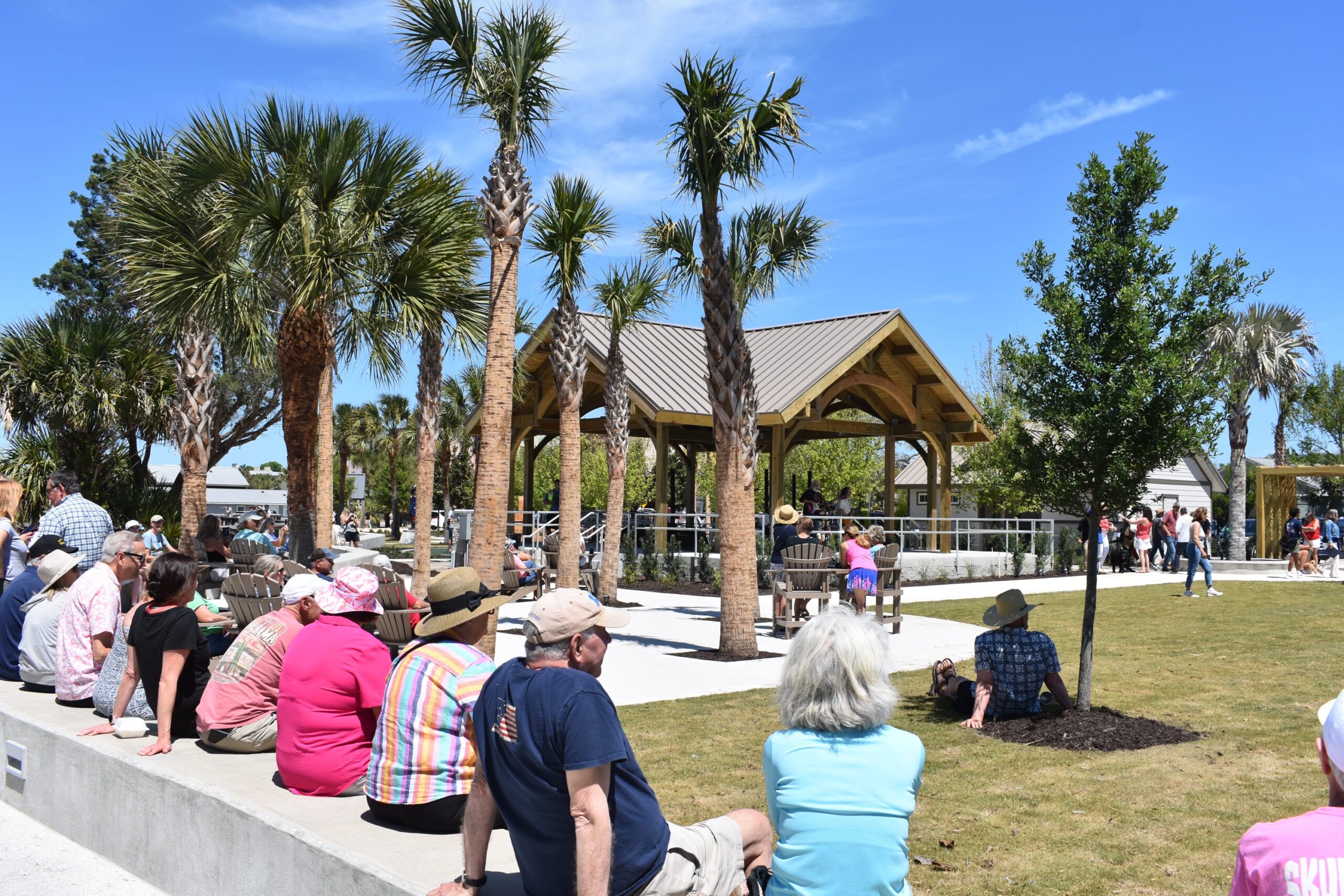 Sun, Songs and a Swashbuckler: Waterfront Park makes its debut Park visitors watch the Honey Badgers perform. Photo by Kate Kimmel/Nassau NewsLine