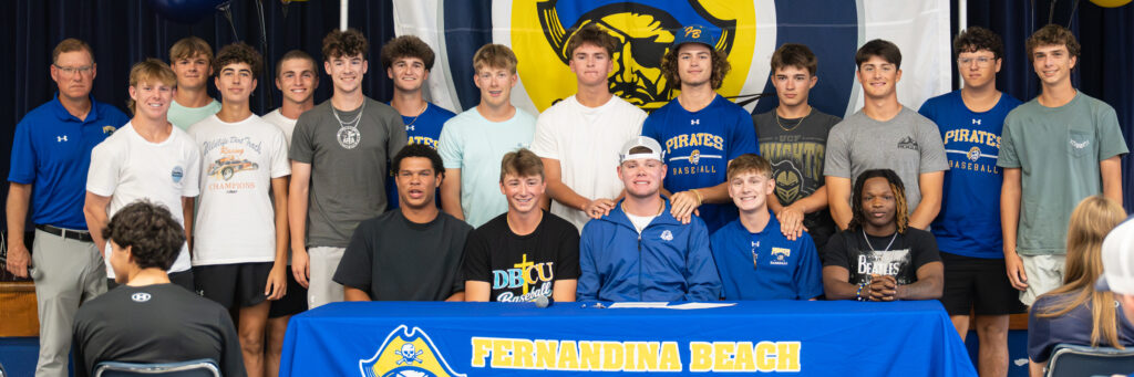 Conner Bayless and Lucas Hutchinson with their coach and teammates. Photo by Penny Glackin/Special to Nassau NewsLine
