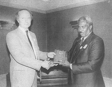 In April 1989, Mayor Ron Sapp awards John Gilbert with the first Elsie Harper Volunteer of the Year award, recognizing 20 years of volunteer youth work in Nassau County at the time. Photo courtesy University of Florida archives