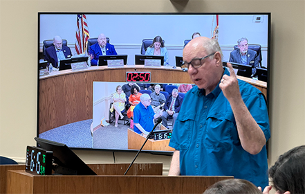 Gary Morgan, a member of the Friends of the Yulee Library, speaks in support of restoring library funding during public comment Sept. 14.