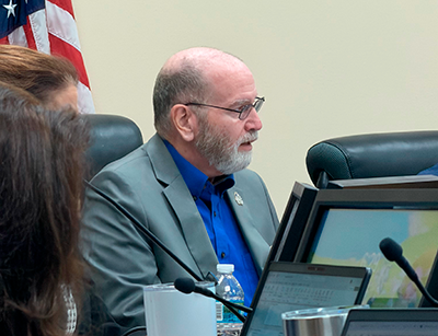 Nassau County Commissioner John Martin discusses proposed cuts to library hours during the Sept. 28 budget hearing. Martin suggested delaying library reductions for a year and called proposed Amendment 3 "a disaster for Nassau County." Photo by Tracy McCormick-Dishman/Nassau NewsLine